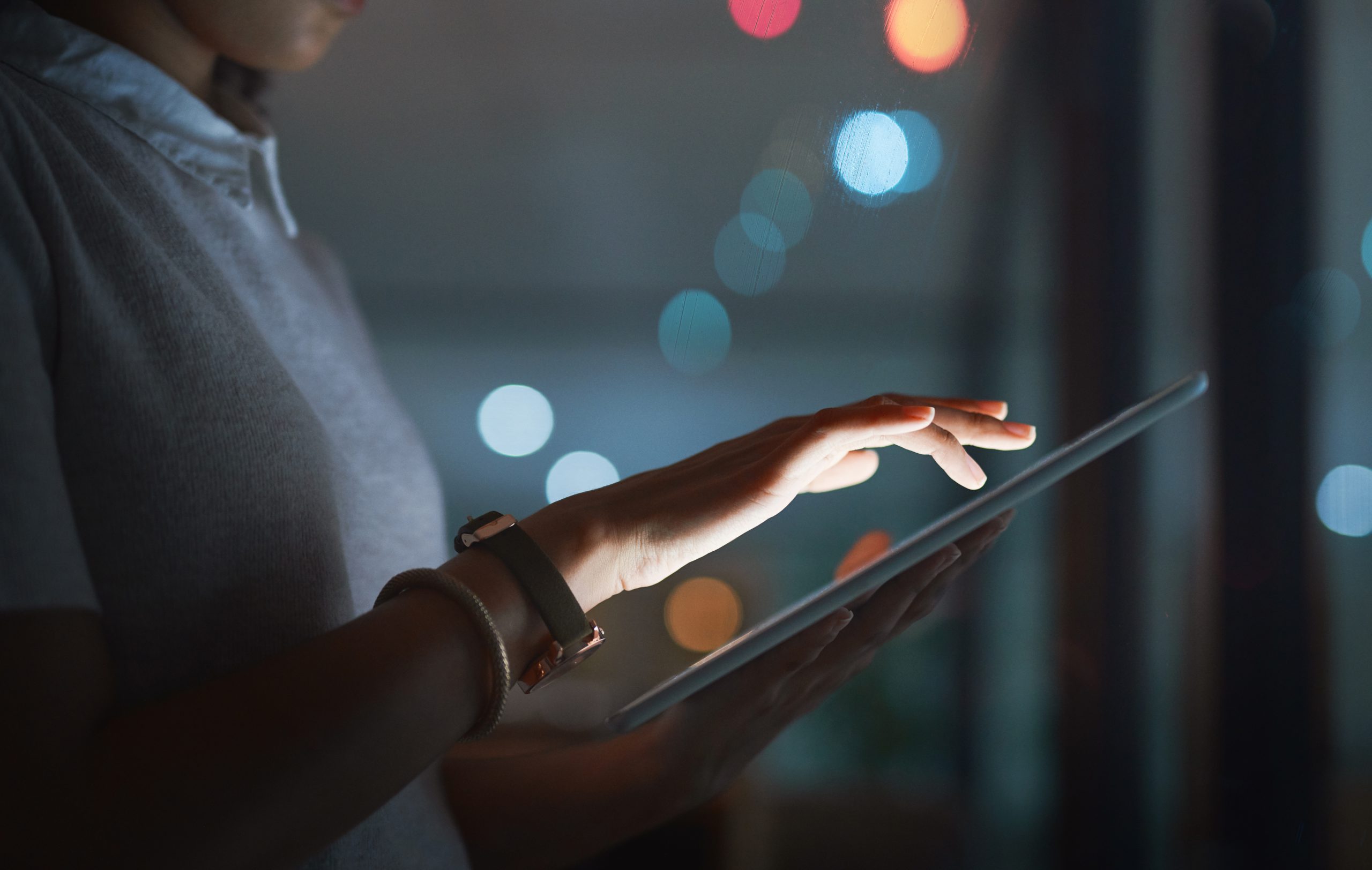 A person holding and Ipad using a safety software